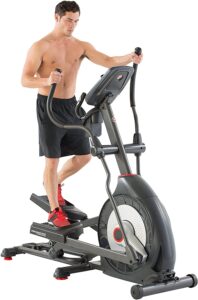 An athlete is exercising on the Schwinn 470 Elliptical