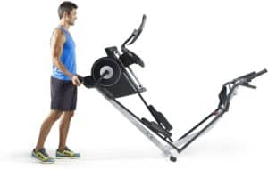 The ProForm Hybrid Elliptical Trainer is being roll away for storage by a male user