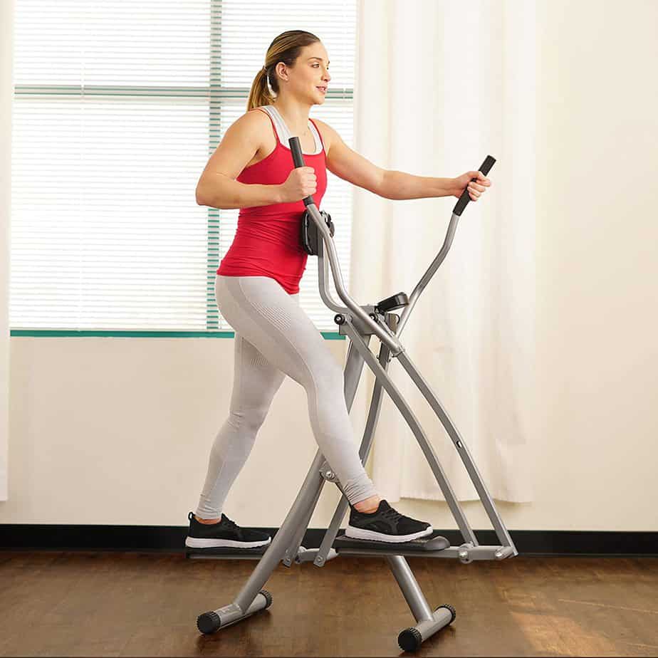 A lady trains with the Sunny Health & Fitness SF-E902 Air Walk Trainer