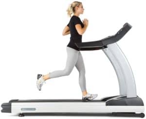 A lady is running on the 3G Cardio Elite Runner Treadmill 