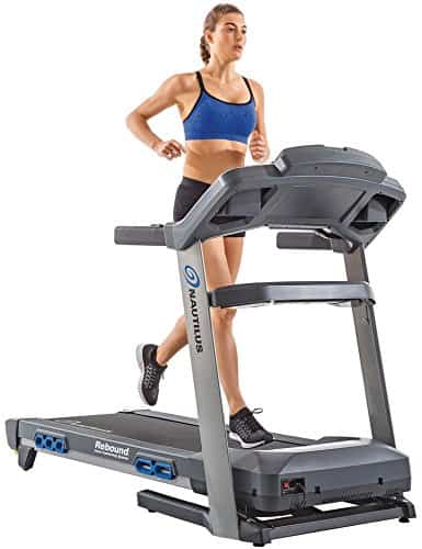 A lady runs on the Nautilus T618 Treadmill Machine Review