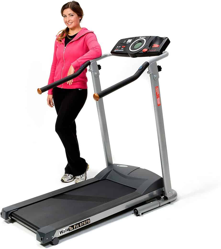 A lady is standing by the Exerpeutic TF900 High Capacity Fitness Walking Electric Treadmill