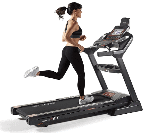 A lady is running on the Sole F63 2019 Folding Treadmill