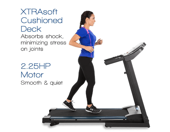 A lady is jogging on the XTERRA Fitness TR150 Folding Treadmill