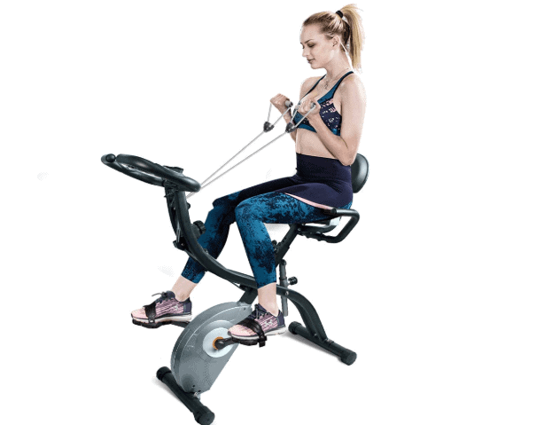 A lady riding the ATIVAFIT Stationary Foldable Exercise Bike while using the arm resistance bands