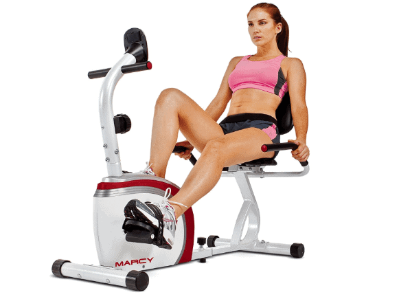 A lady riding the Marcy Recumbent Exercise Bike with Pulse Sensors NS-908R