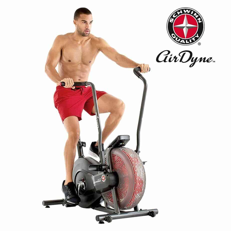 An man is working out on the Schwinn AD2 Airdyne Bike