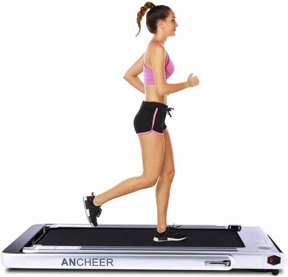 An athlete uses the ANCHEER 2-in-1 Folding Treadmill in under-desk mode