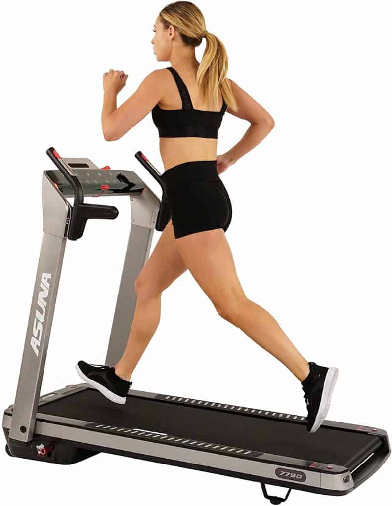 A lady is running on the Sunny Health & Fitness ASUNA 7750 Folding Treadmill 