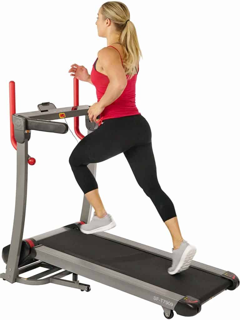 A lady jogging on the Sunny Health & Fitness Folding Electric Treadmill SF-T7909 