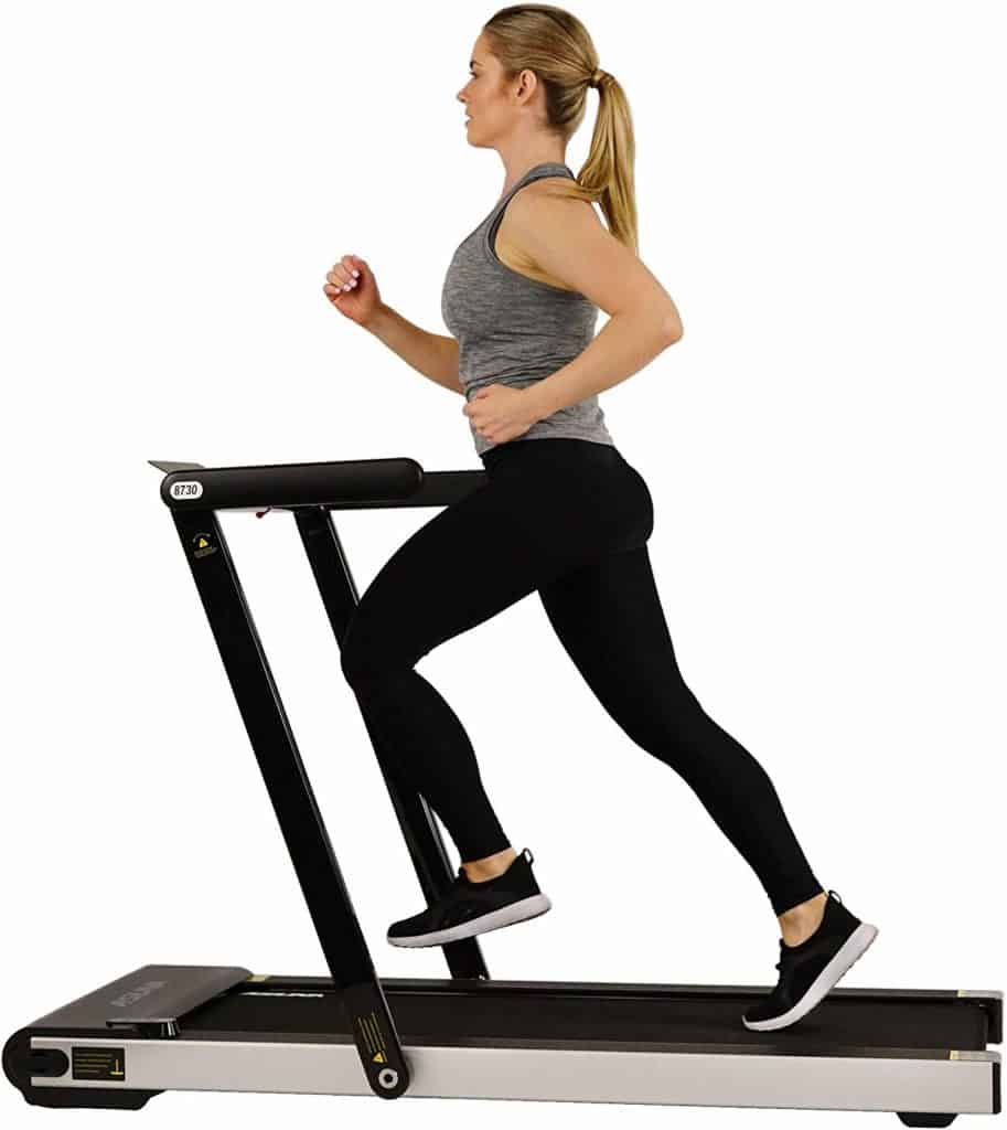 A lady-athlete is jogging on the Sunny Health & Fitness ASUNA 8730 Treadmill
