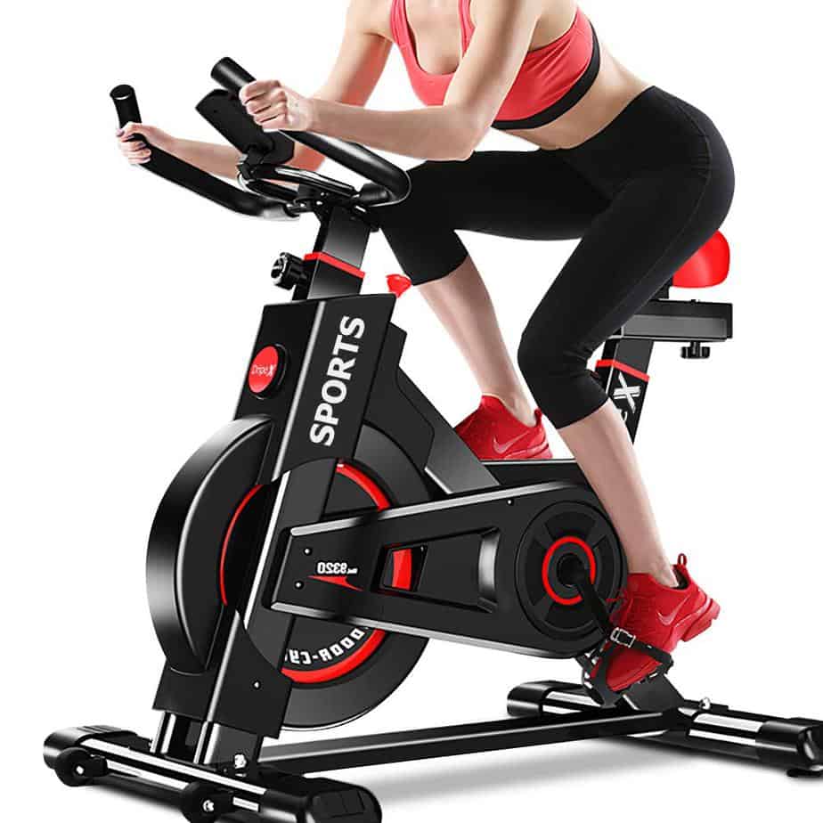 A lady exercising with the Dripex Indoor Exercise Bike