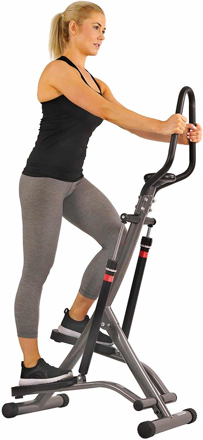 A lady is stepping on the Sunny Health and Fitness SF-1115 Folding Climbing Stepper