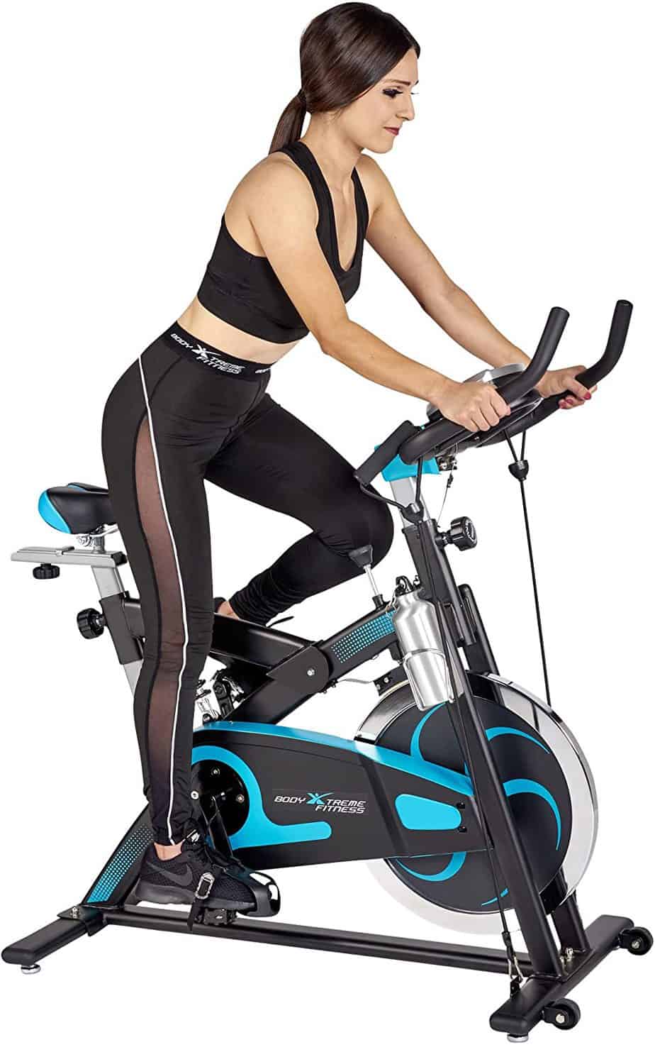 A lady is excercising with the Body Xtreme Fitness Bundle BXF004 Exercise Bike