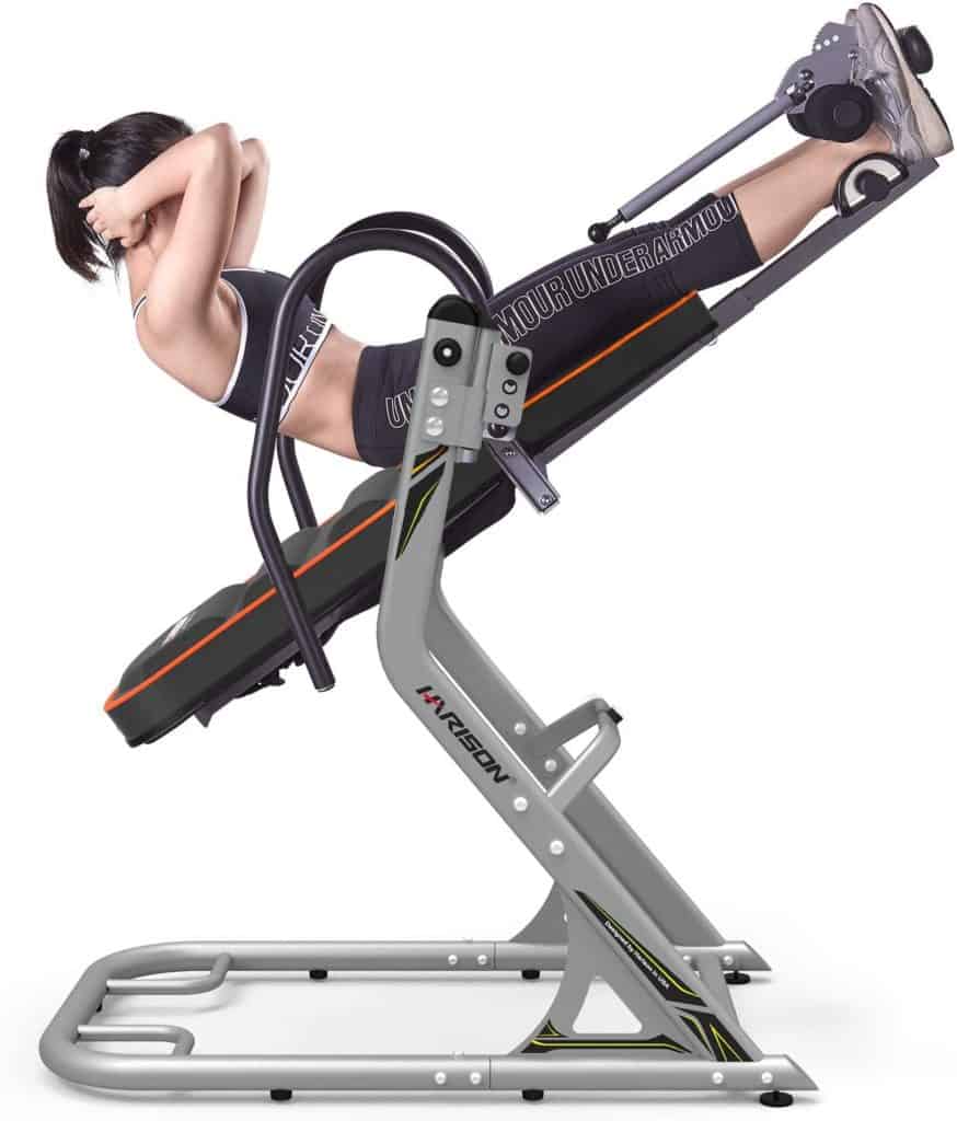 A lady is exercising on the HARISON 407 Inversion Table 