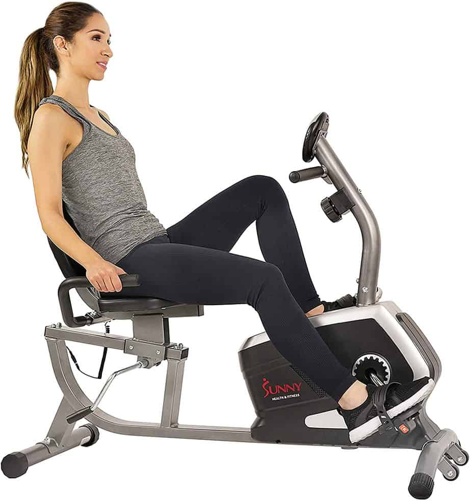 A lady exercising with the Sunny Health and Fitness SF-RB4616 Magnetic Recumbent Bike