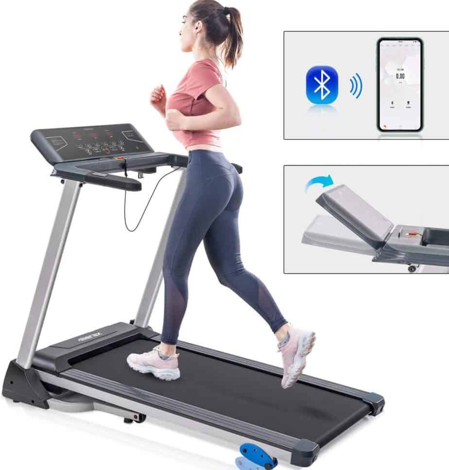 A lady jogs on the Merax Folding Electric Treadmill