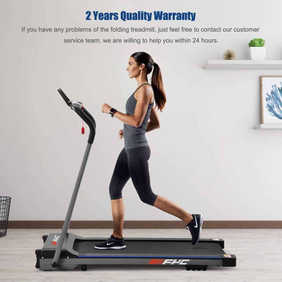 A lady is jogging on the FYC JK1608E-1 Folding Compact Home Treadmill