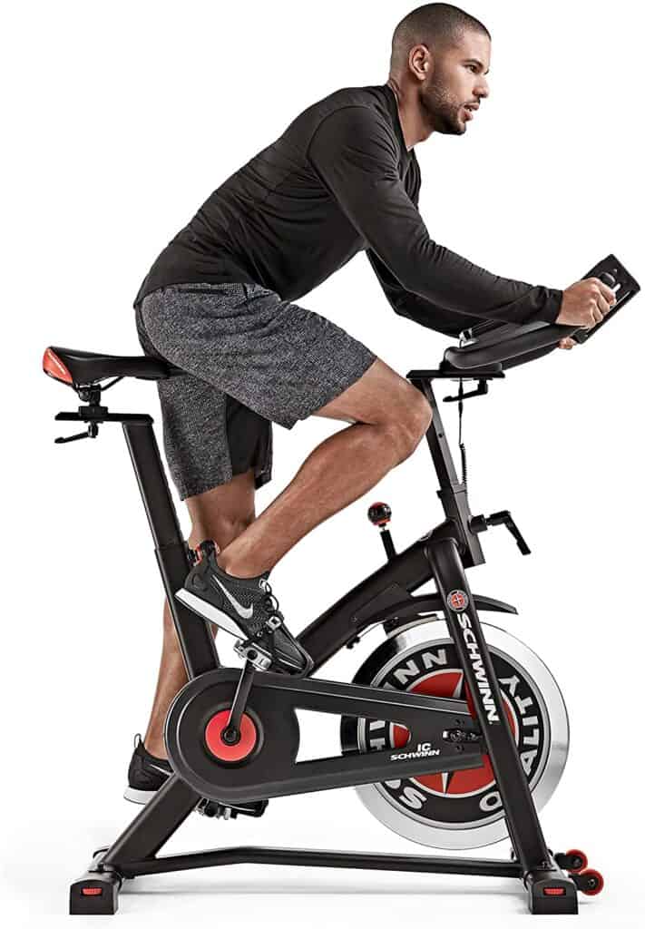 A man rides on the Schwinn IC3 Indoor Cycling Exercise Bike