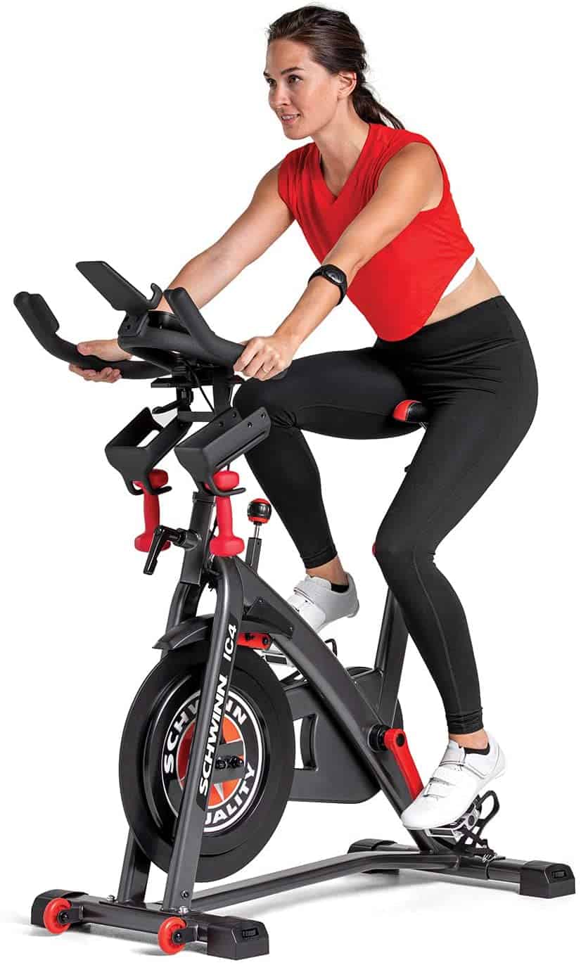 A lady rides the Schwinn IC4 Indoor Cycling Exercise Bike