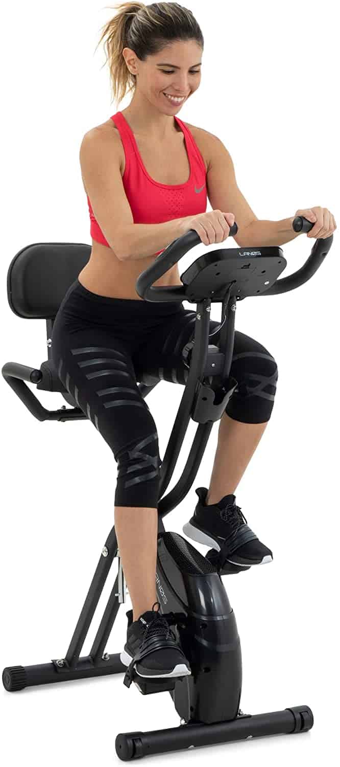 A lady rides the Lenos Semi-Recumbent 3-in-1 Folding Indoor Exercise Bike