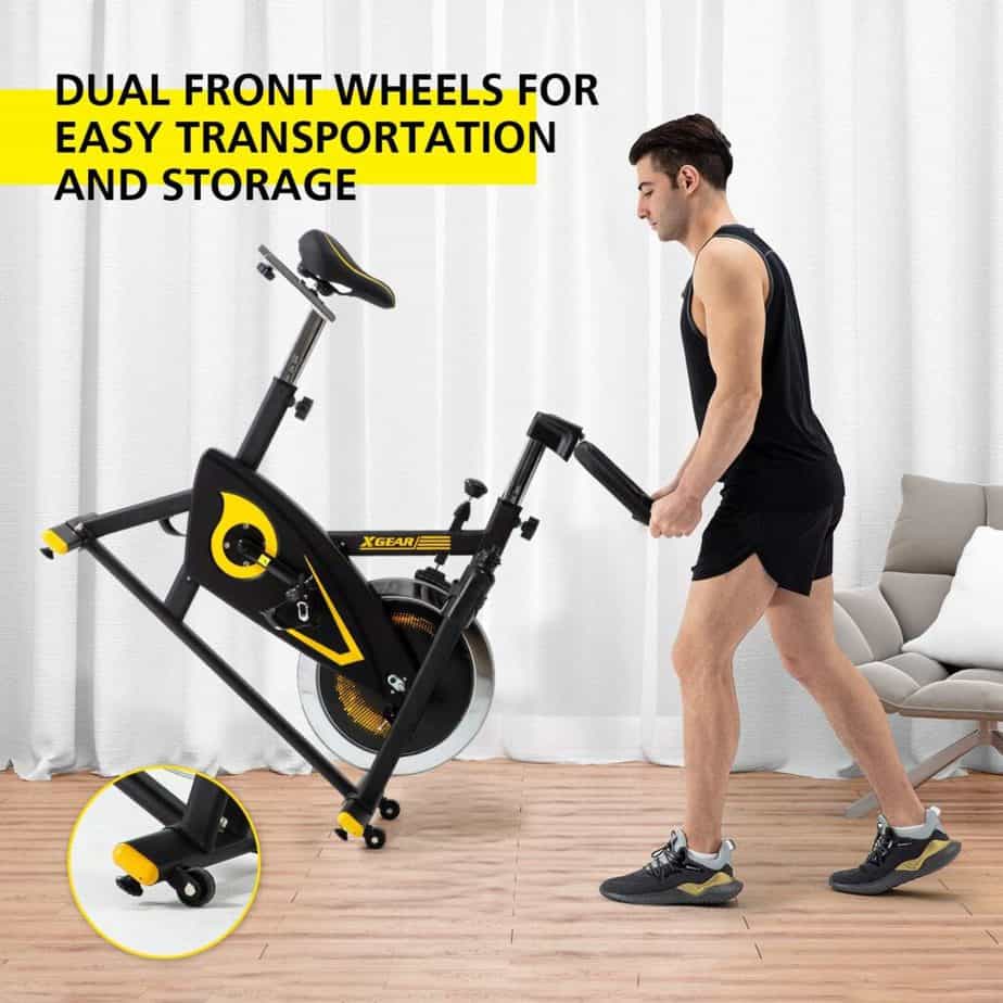 The XGEAR Magnetic Indoor Exercise Bike is being rolled away for storage