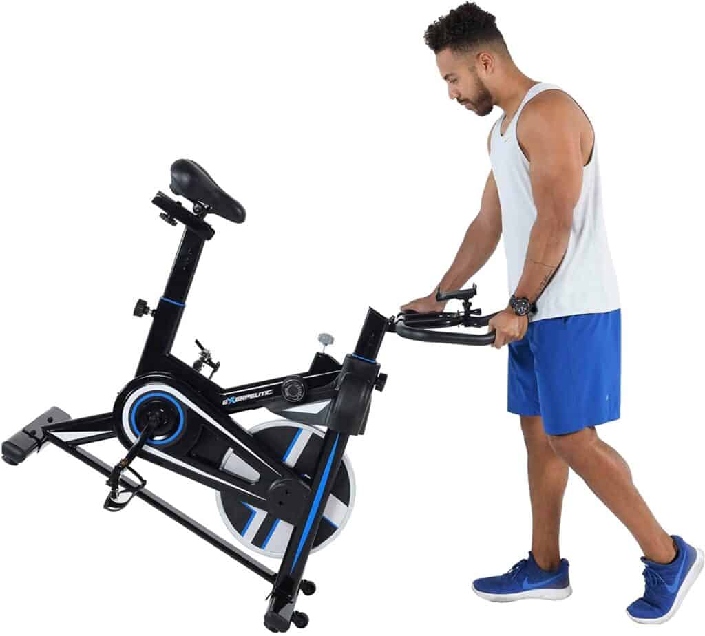 A user moves the Exerpeutic LX 3000 Indoor Cycling Exercise Bike (4210) for storage