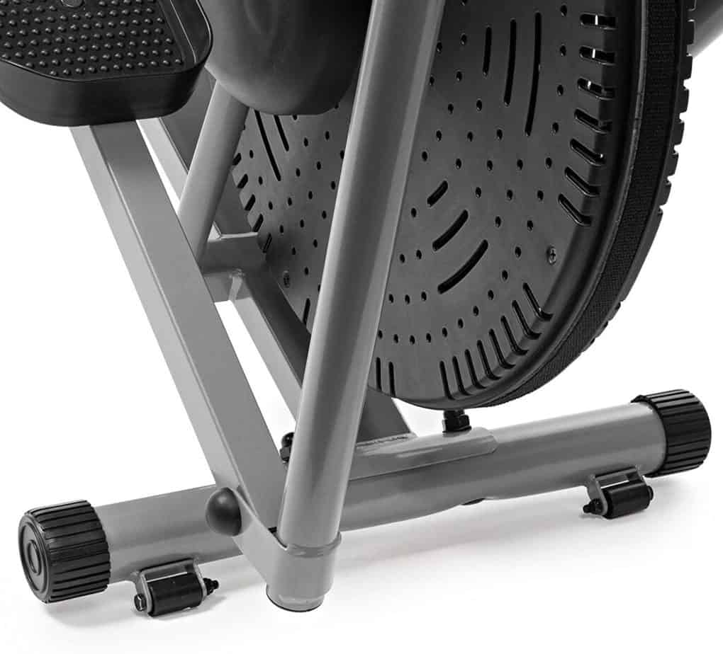 The Plasma Fit 2350X-Pro Elliptical Cross Trainer is tilted toward the transport wheels ready to be rolled away for storage 