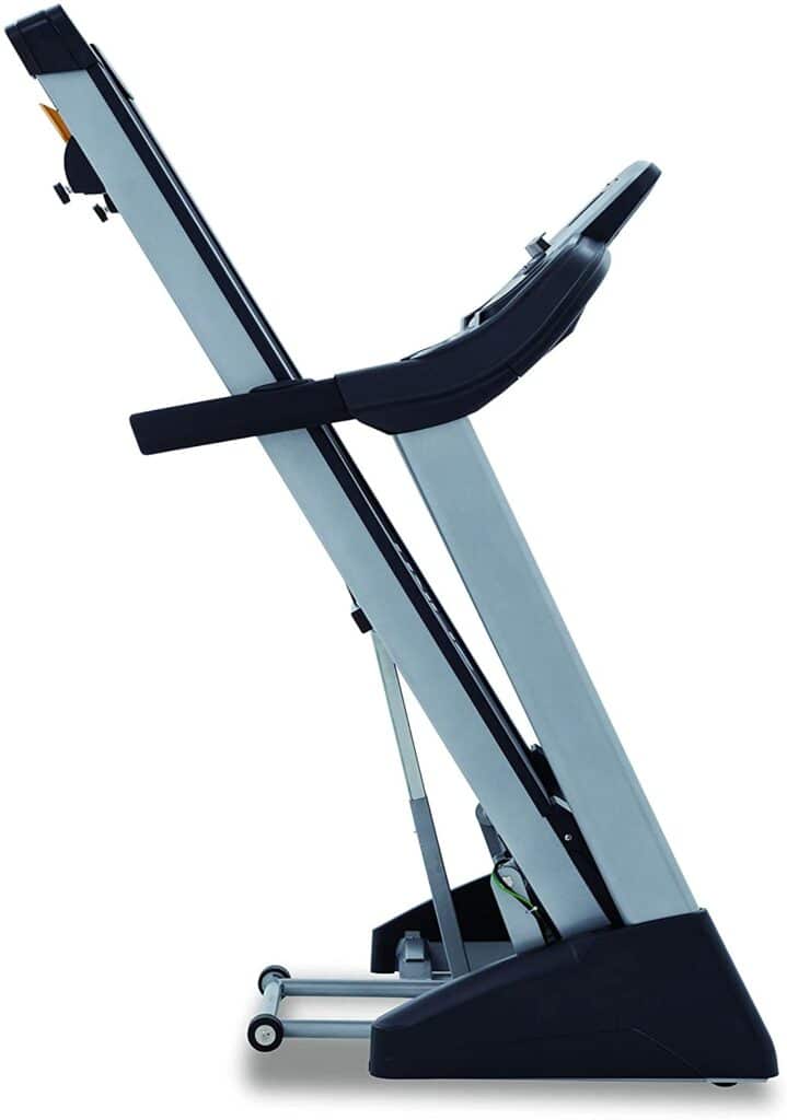 The Spirit Fitness XT285 Folding Treadmill is folded for storage