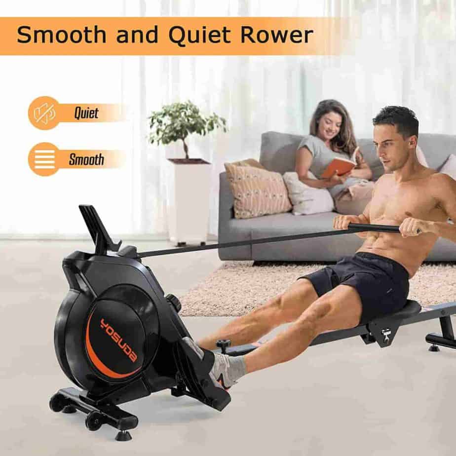 A user exercises with the YOSUDA 100 Magnetic Rower in the presence of the wife and baby