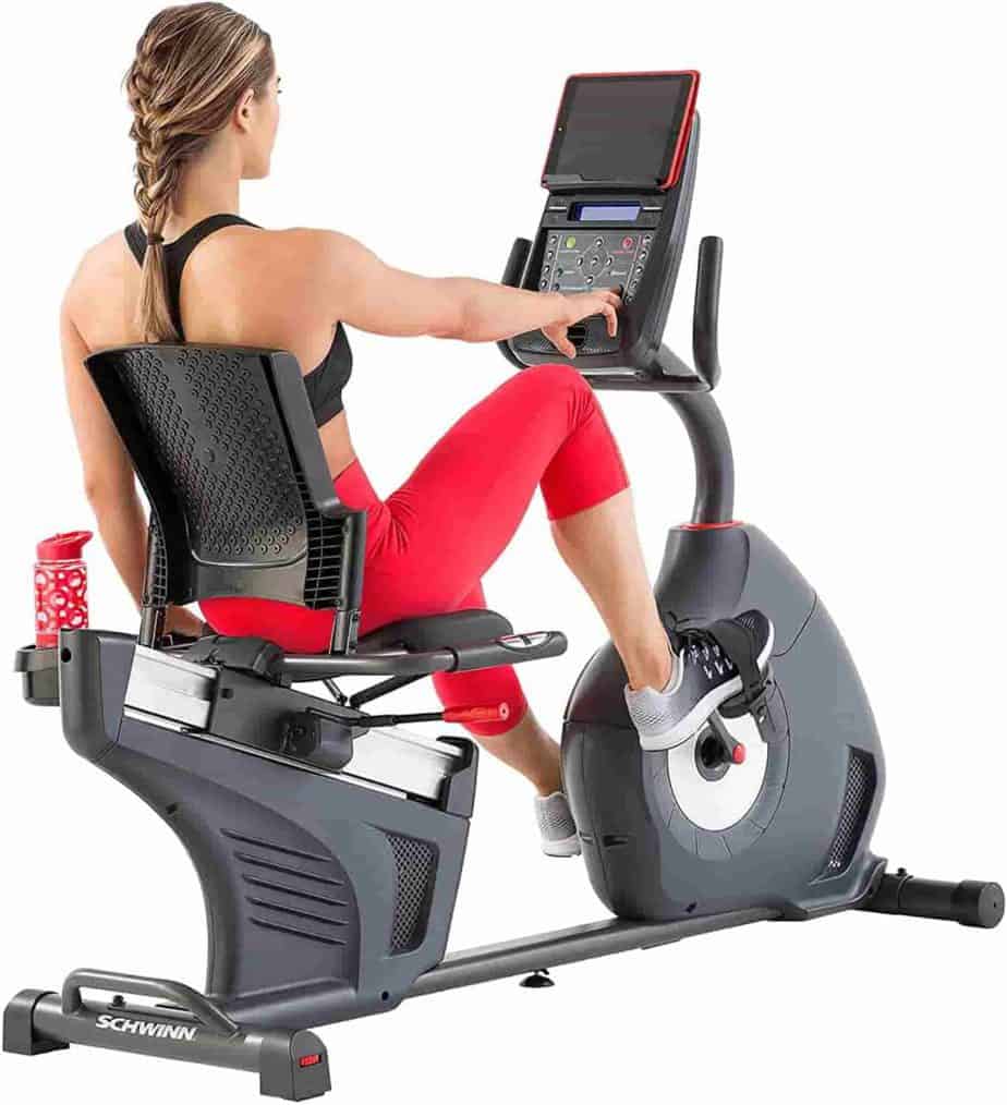 A lady works out with the Schwinn 270 Recumbent Bike