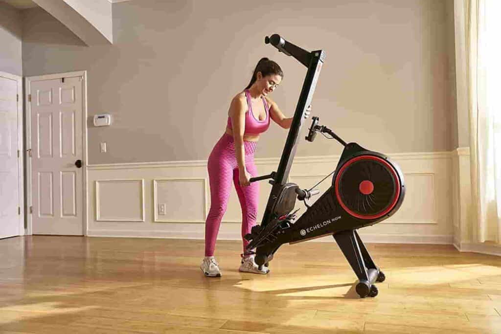 The Echelon Smart Rowing Machine is being fold up by the user