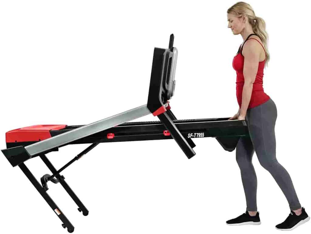 User rolls away the Sunny Health & Fitness Evo-Fit SF-T7955 Treadmill  for storage