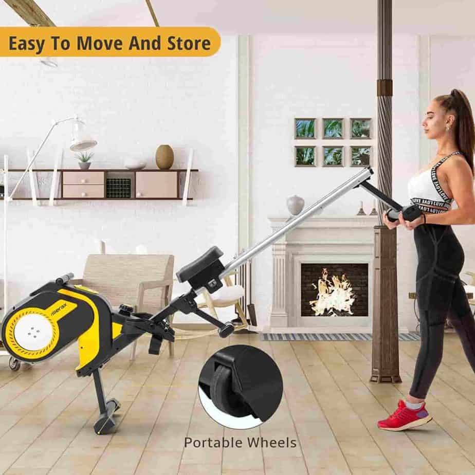 A lady rolls away the Merax Folding Magnetic Rowing Machine  for storage