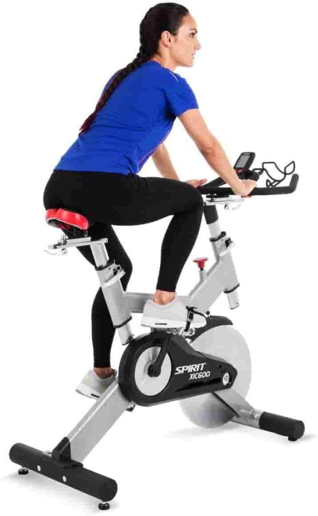 A lady rides the Spirit Fitness XIC600 Indoor Cycling Bike