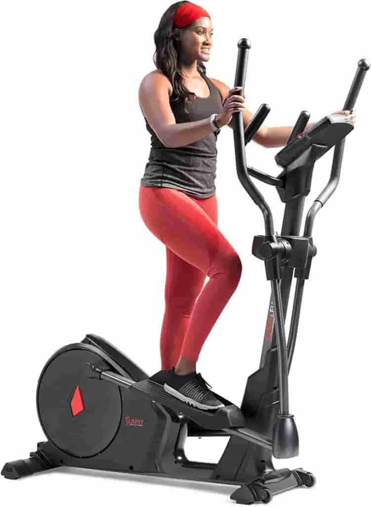 A lady exercises with the Sunny Health & Fitness SF-E3912SMART Elliptical Trainer