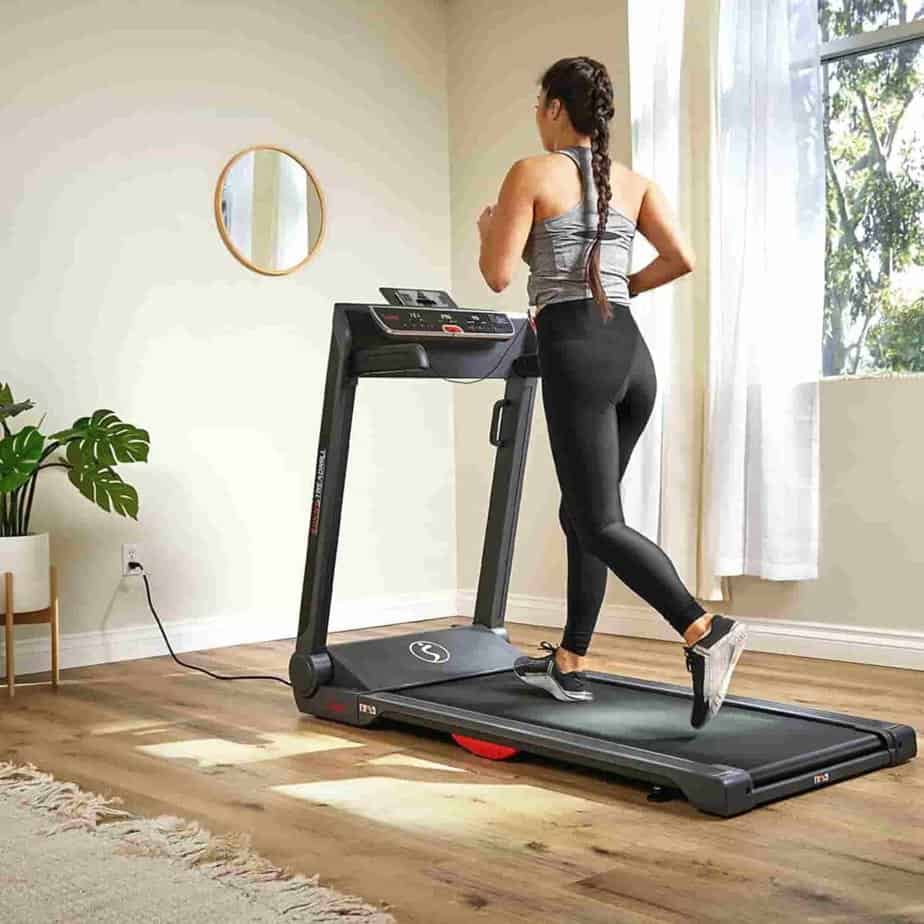 She jogs on the Sunny Health & Fitness SF-T7718SMART Treadmill