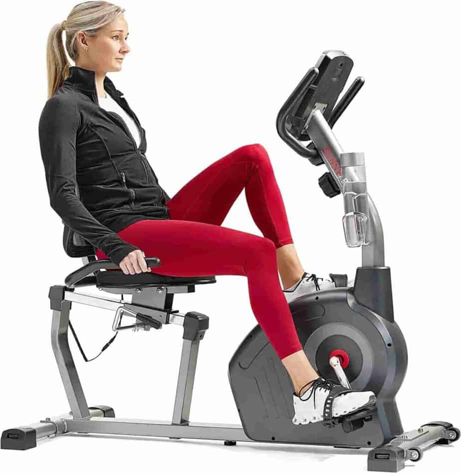 Lady exercises with the Sunny Health & Fitness SF-RB420046 Elite Interactive Recumbent Bike