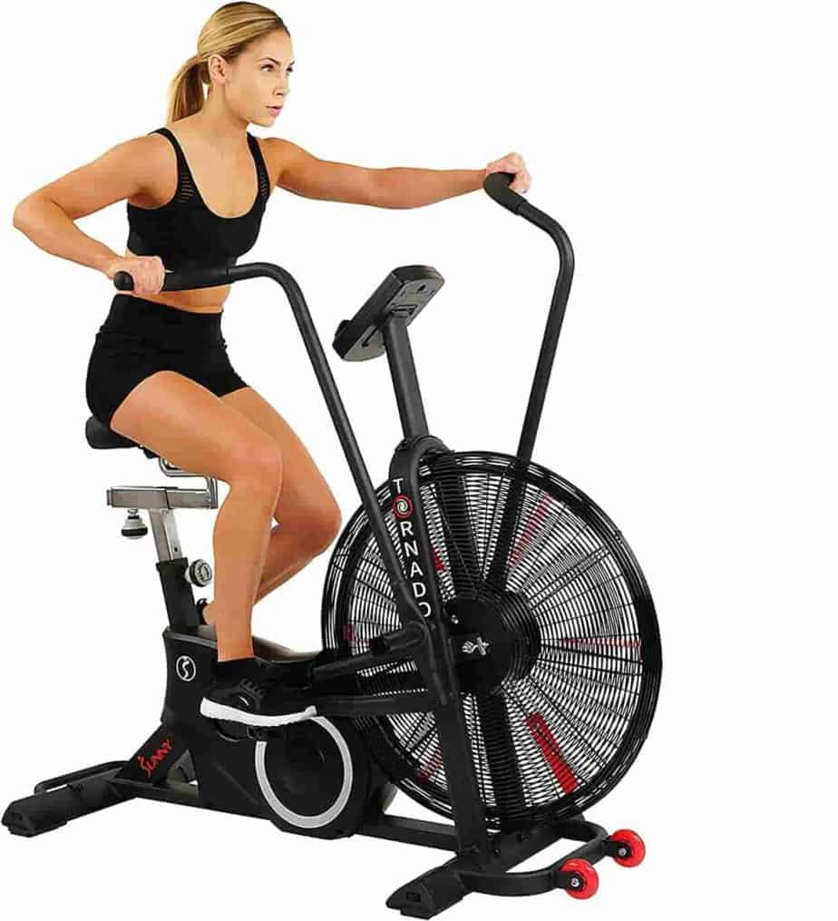 A lady rides the Sunny Health & Fitness SF-B2729 Air Bike