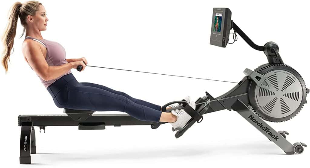 A lady rows on the Nordic Track RW600 Air & Magnetic Rower