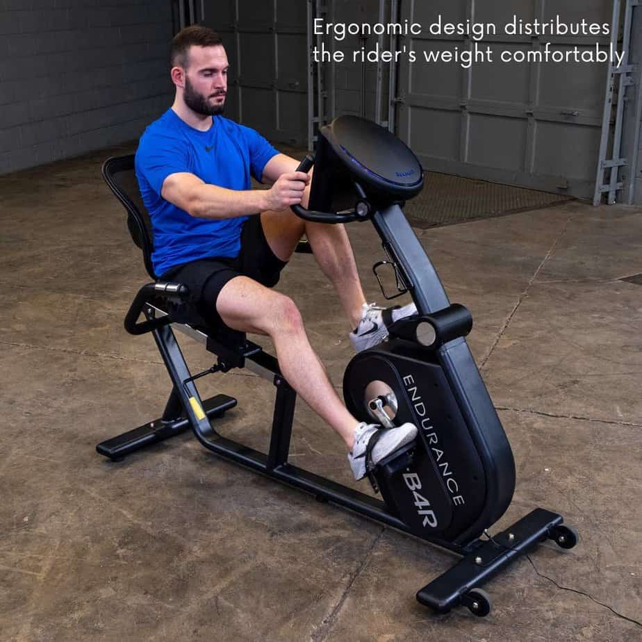 A man exercises with the Body-Solid B4R Endurance Recumbent Bike