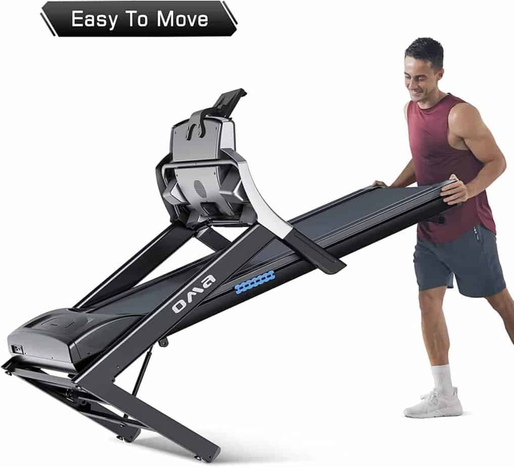 A user folds and rolls away the OMA 5925CAI Motorized Treadmill to storage area
