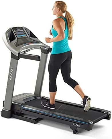 A lady runs on the HORIZON Elite T5 Treadmill