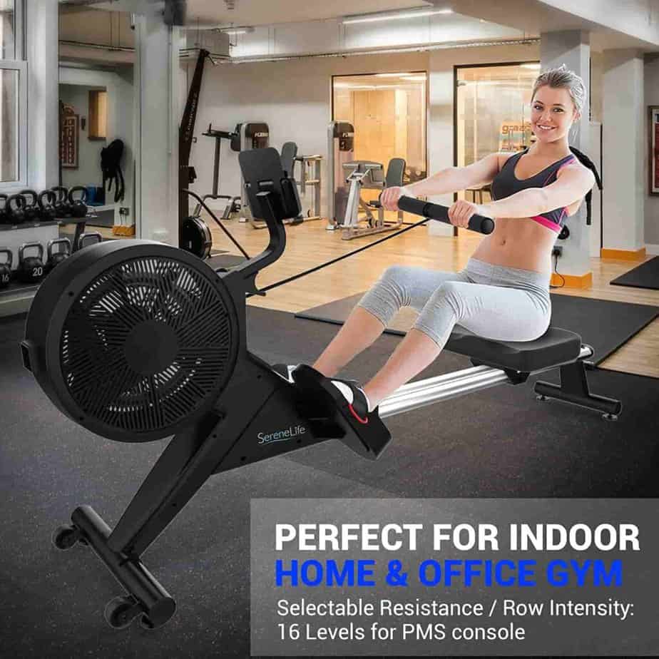 A lady enjoys exercising with the SereneLife SLRWMC60 Rower