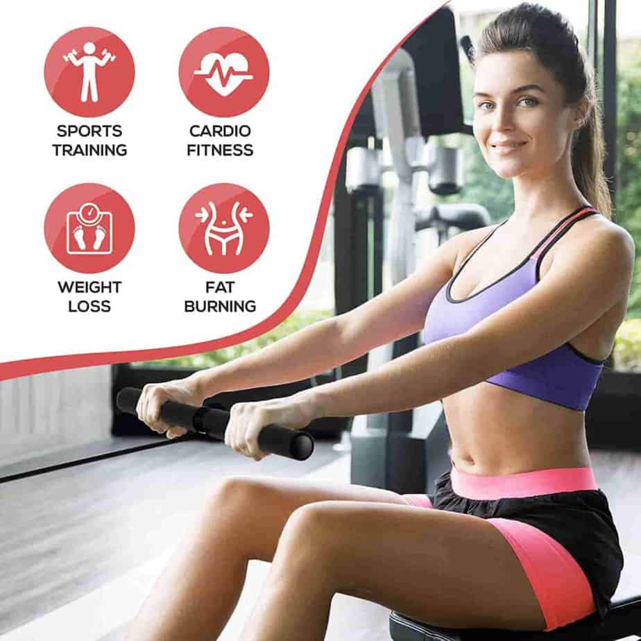 A lady workouts on the  SereneLife SLRWMC10 Magnetic Rowing Machine