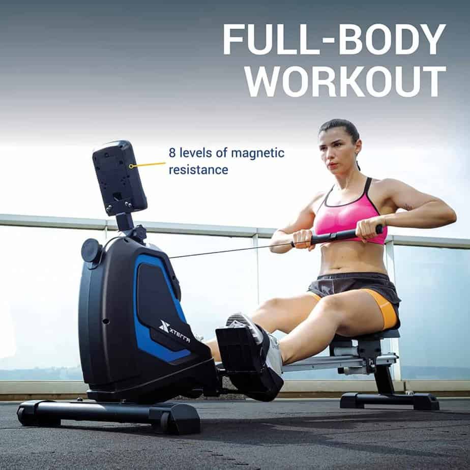A lady rows on the XTERRA Fitness ERG160 Rower