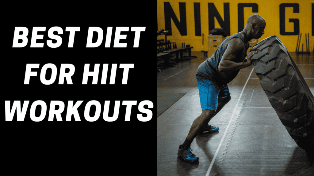 An athlete pushes a tractor tire as he engages in HIIT workouts