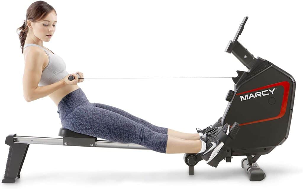 A lady exercises with the Marcy NS-6002RE Magnetic Rower