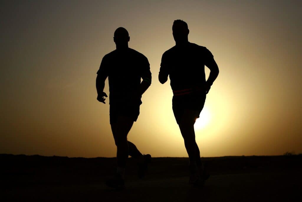 Men exercising by running at the sunrise
