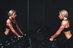 The ladies exercise with dumbbells